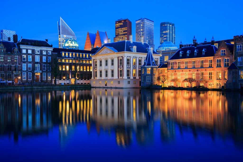 The skyline of the Hague and a lake at Blue Hour