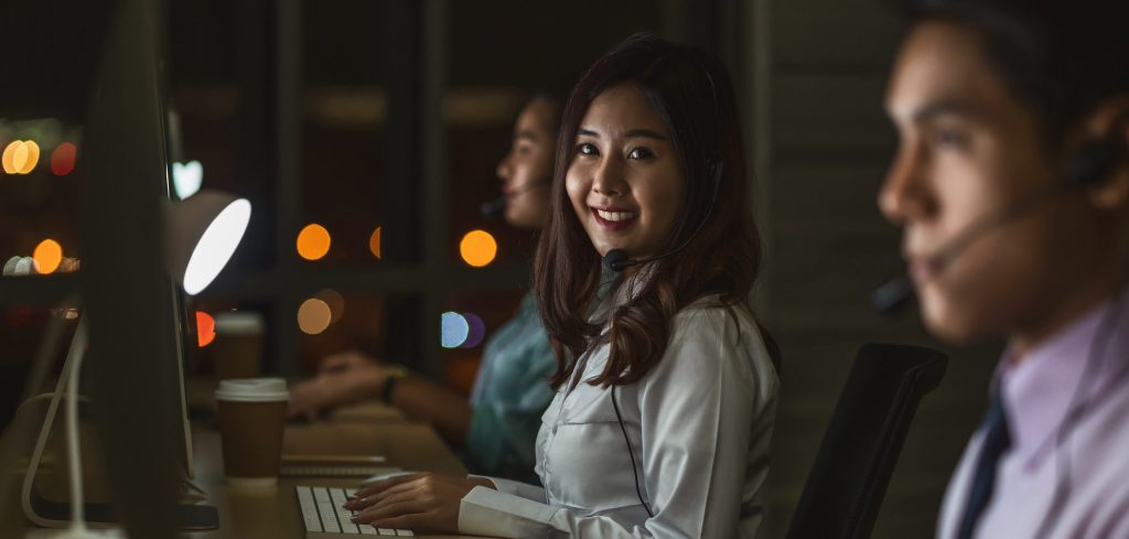 Portrait of Asian Female customer care service with business man smiling